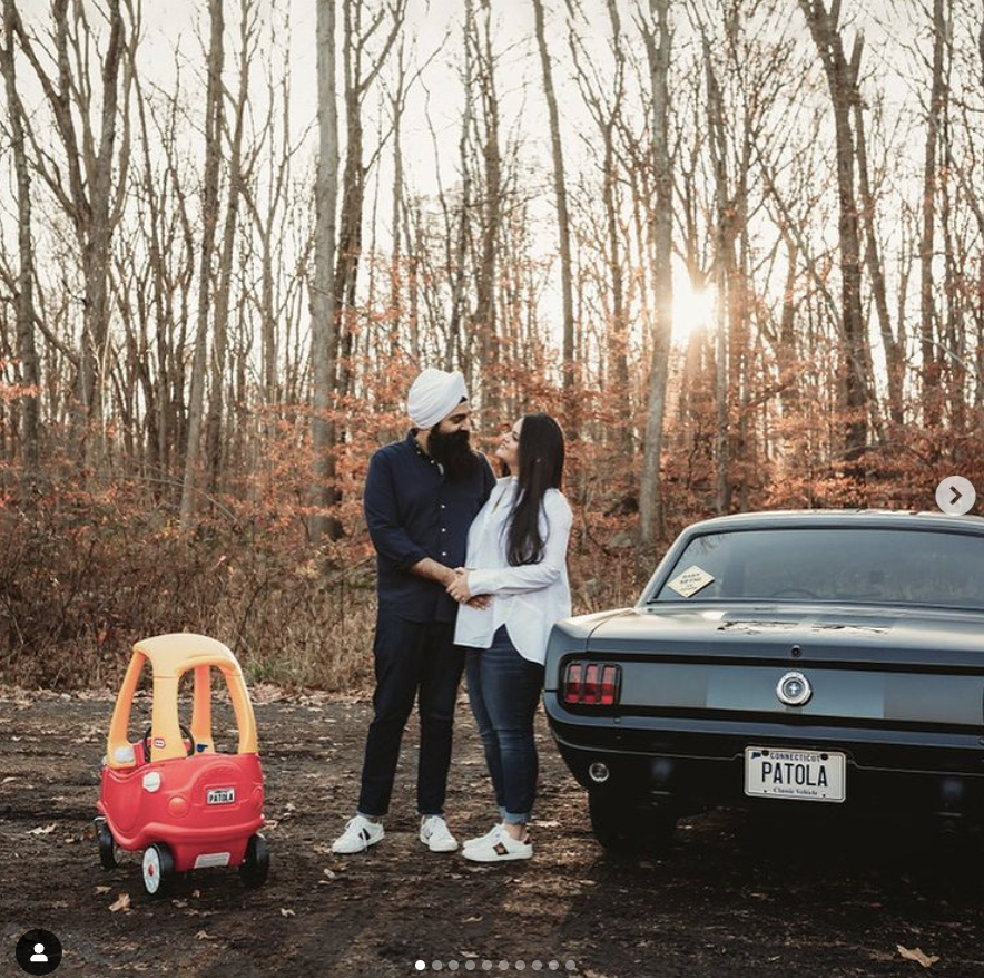 couple with car and toy car pregnancy announcement 