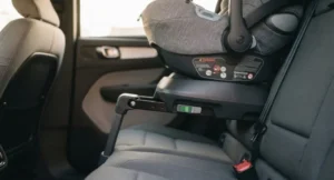 ISOFIX base securing a baby car seat in a car's rear seat